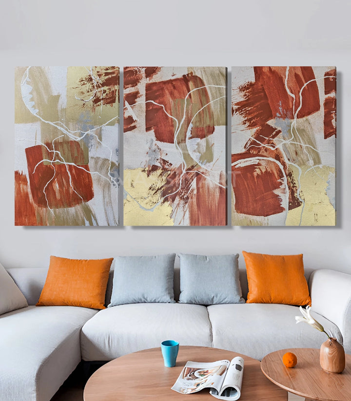 Tableau abstrait feuilles terracotta triptyque canapé blanc Massinart