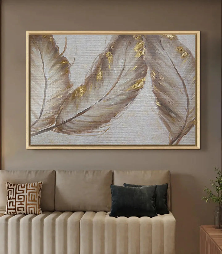 Tableau Ivory Feathers décoration intérieur salon avec coussins dorés