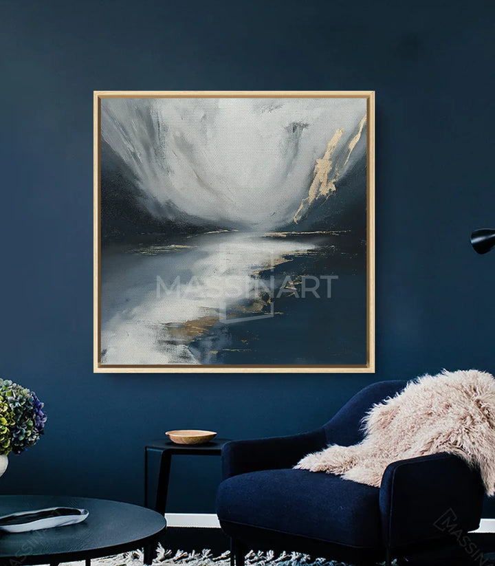 Décoration intérieur séjour - Tableau paysage lacustre au-dessus fauteuil bleu marine Massinart