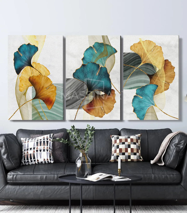 Mise en situation salon moderne — triptyque Ginkgo Leaves au-dessus canapé noir, Massinart